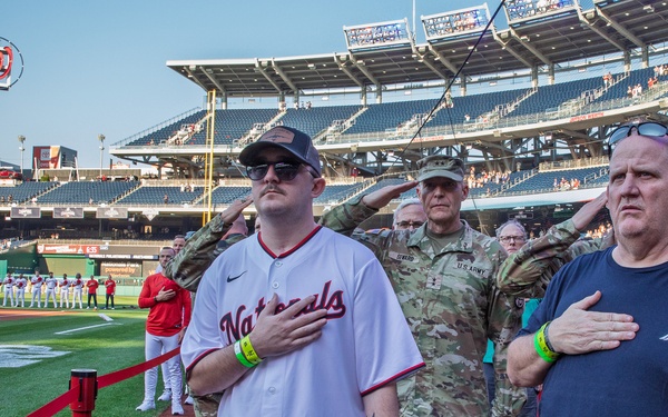 Staff Sgt. Andrew Wolfe Throws First Pitch at Washington Nationals National Guard Appreciation Game