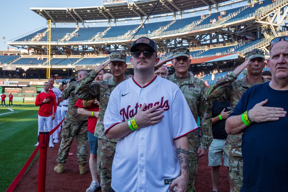 Staff Sgt. Andrew Wolfe Throws First Pitch at Washington Nationals National Guard Appreciation Game
