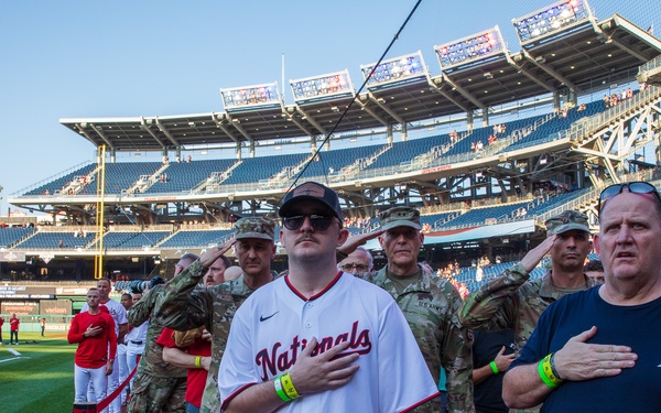 Staff Sgt. Andrew Wolfe Throws First Pitch at Washington Nationals National Guard Appreciation Game