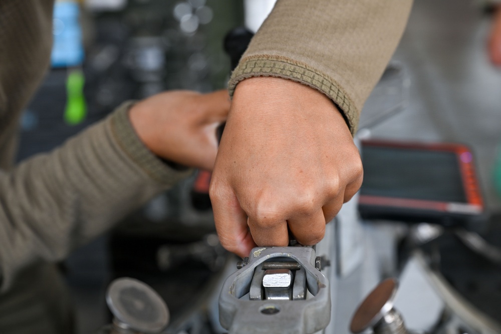 Airman assembles aircraft weapon components