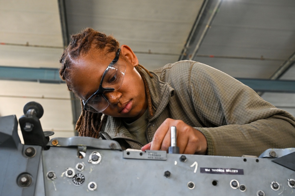 Airman assembles aircraft weapon components