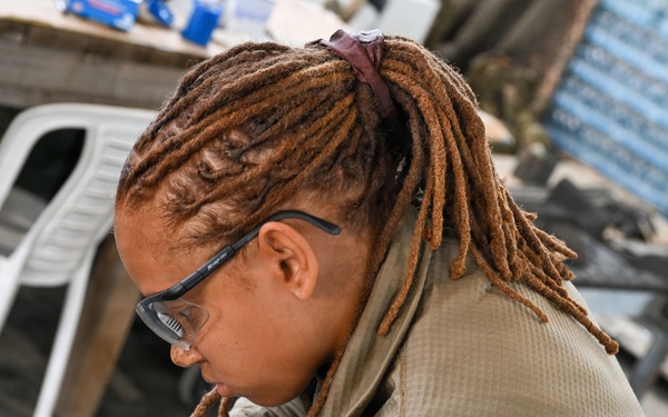 Airman assembles aircraft weapon components