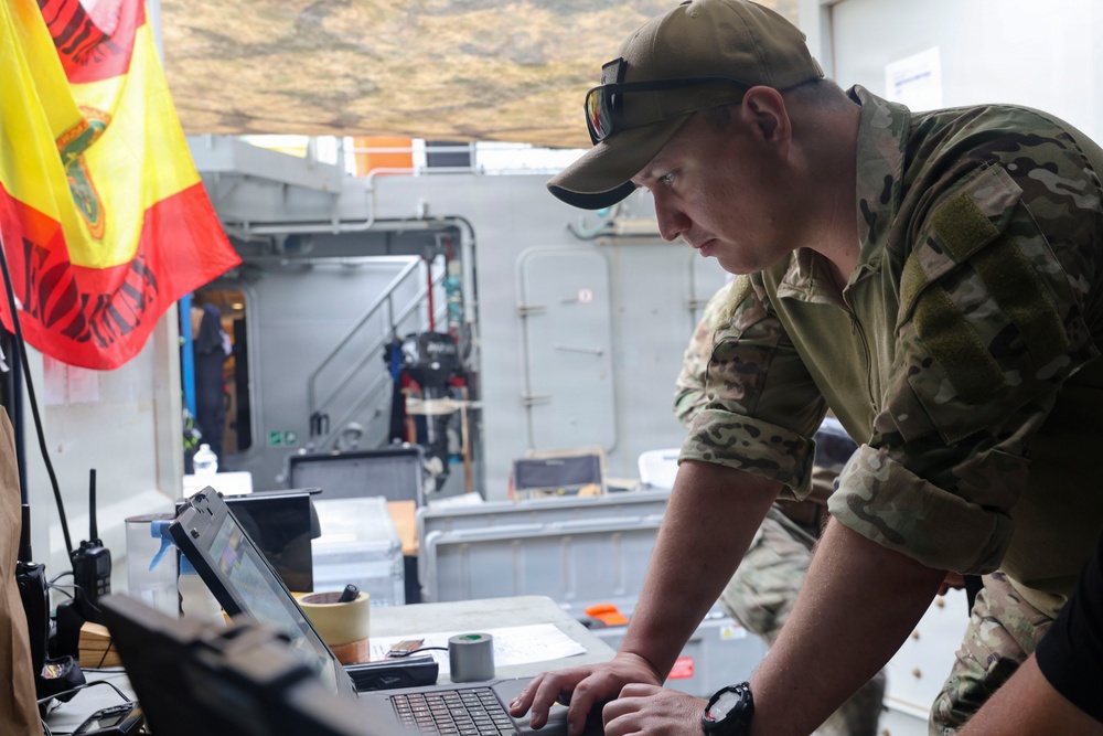 MN1 Merrick Ziegenbein verifies data during ESP MINEX-26 with the Spanish Armada
