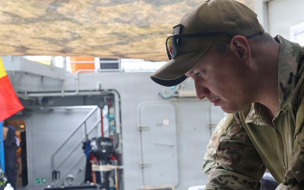 MN1 Merrick Ziegenbein verifies data during ESP MINEX-26 with the Spanish Armada