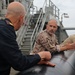 RWC Justin Weatherford discuss loading an unmanned underwater vehicle (UUV) with the Spanish Armada