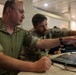 MN1 Merrick Ziegenbein 3 conducts a post mission analysis with Spanish Mariner First Sergeant Fran Morcillo during ESP MINEX-26