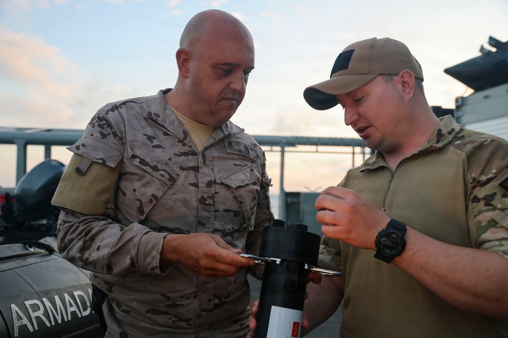 MN1 Merrick Ziegenbein demonstrates UUV equipment with Spanish Mariners during ESP MINEX-26
