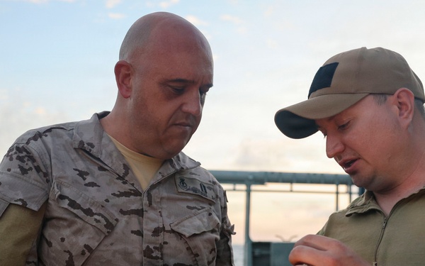 MN1 Merrick Ziegenbein demonstrates UUV equipment with Spanish Mariners during ESP MINEX-26