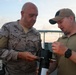 MN1 Merrick Ziegenbein demonstrates UUV equipment with Spanish Mariners during ESP MINEX-26