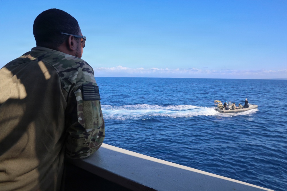 OS1 Drew Upchurch observes RHIB maneuvers from the Spanish multi-purpose ship ESPS Cartagena during ESP MINEX-26