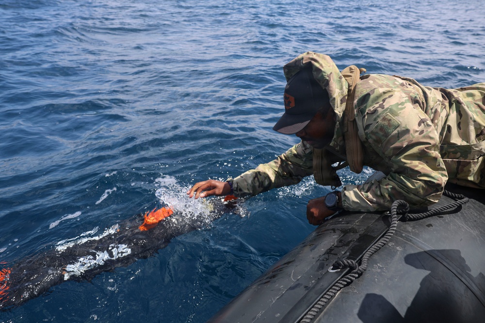 OS1 Drew Upchurch launches an MK 18 Mod 1 Unmanned Underwater Vehicle during ESP MINEX-26