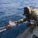 OS1 Drew Upchurch launches an MK 18 Mod 1 Unmanned Underwater Vehicle during ESP MINEX-26