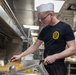 Sailors prepare food aboard USS Donald Cook