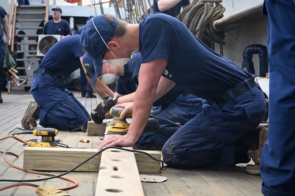 Crew and cadets prepare US Coast Guard Cutter Eagle for paint