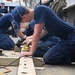 Crew and cadets prepare US Coast Guard Cutter Eagle for paint