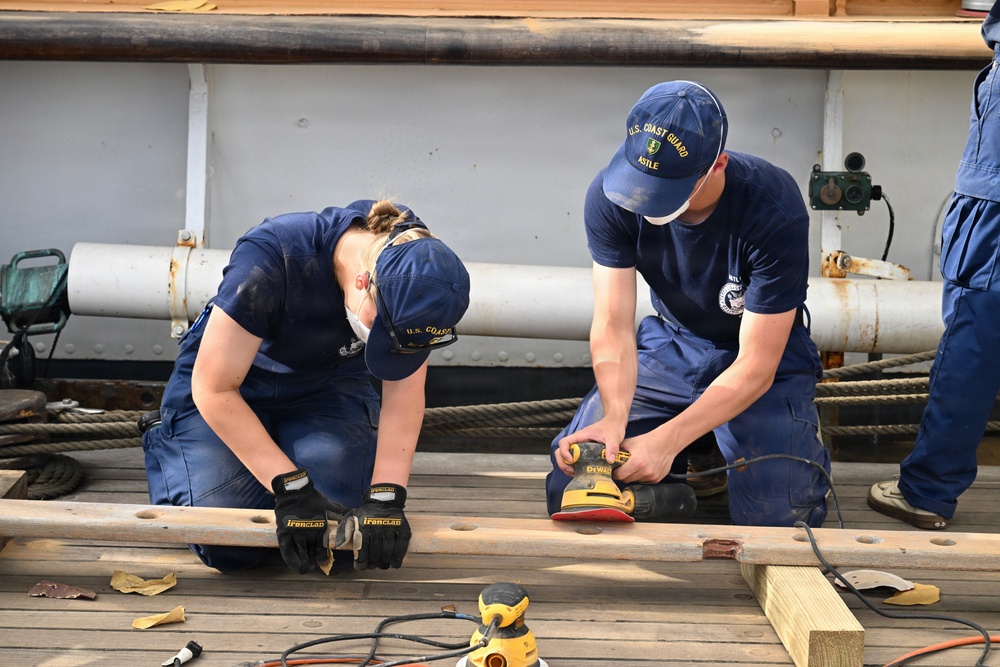 USCGC Eagle crew and cadets prep the training barque for paint ahead of America 250 events