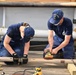 USCGC Eagle crew and cadets prep the training barque for paint ahead of America 250 events