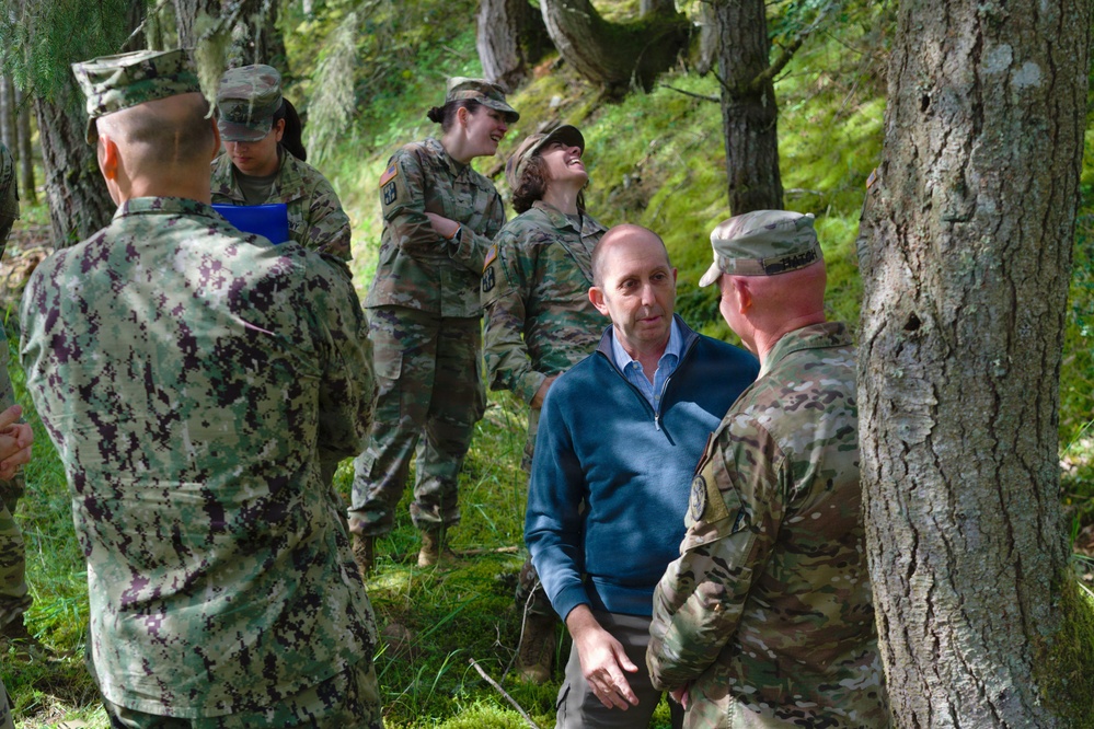 Assistant Secretary of War for Health Affairs Dr. Stephen Ferrara speaks with instructors and residents of Madigan Graduate Medical Education Program's CAPSTONE FTX 2026