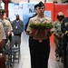 Master at Arms Carries Wreath During NSAW Security Force Memorial