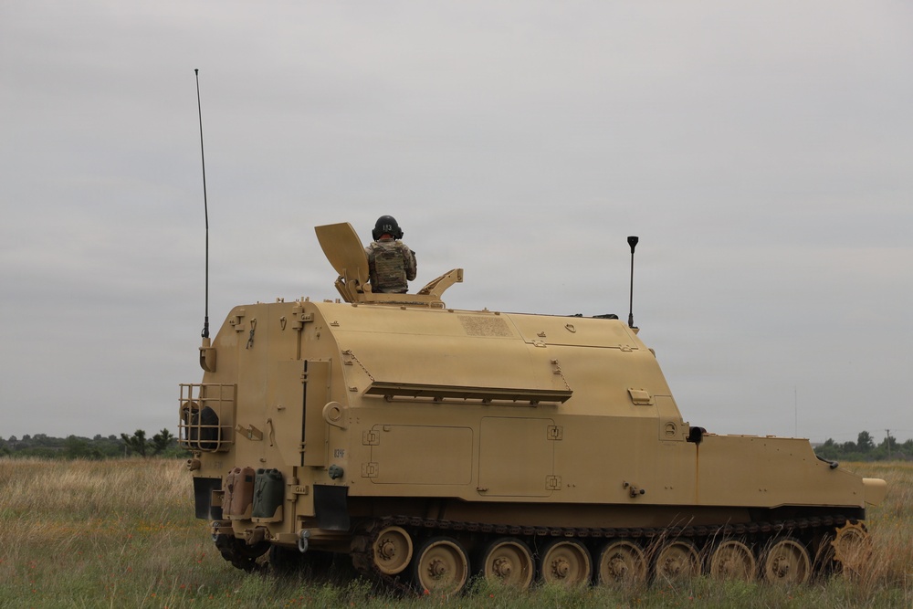 Best Redleg Competitors from 1st Armored Division Artillery shoot live rounds during the Best Redleg Competition