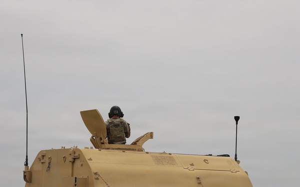 Best Redleg Competitors from 1st Armored Division Artillery shoot live rounds during the Best Redleg Competition