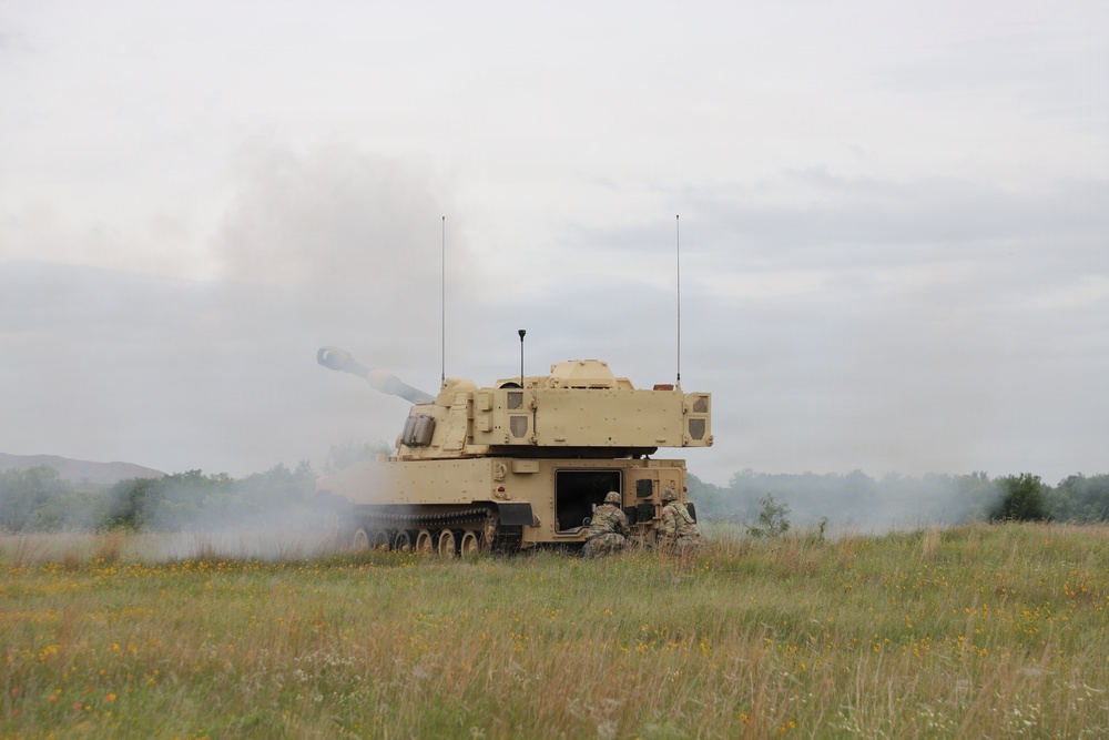 Best Redleg Competitors from 1st Armored Division Artillery shoot live rounds during the Best Redleg Competition