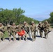 Best Redleg Competitors from 1st Armored Division Artillery complete the 12 mile ruck to conclude the 2026 Best Redleg Competition
