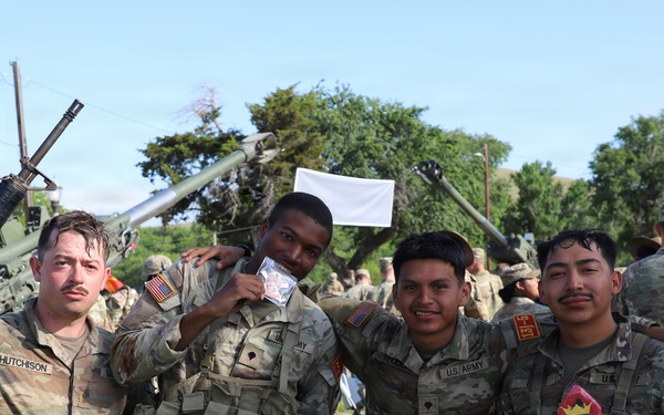 Best Redleg Competitors from 1st Armored Division Artillery complete the 12 mile ruck to conclude the 2026 Best Redleg Competition