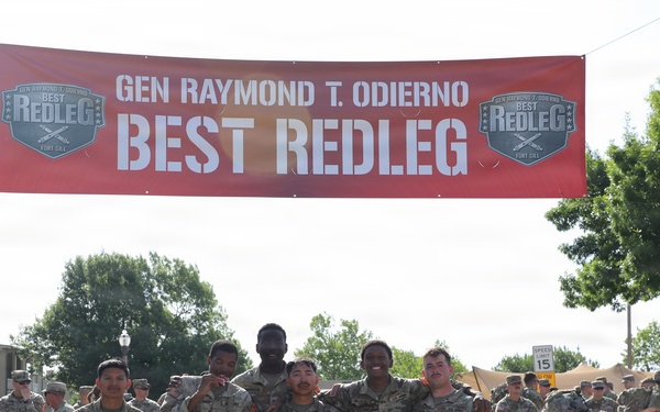 Best Redleg Competitors from 1st Armored Division Artillery complete the 12 mile ruck to conclude the 2026 Best Redleg Competition