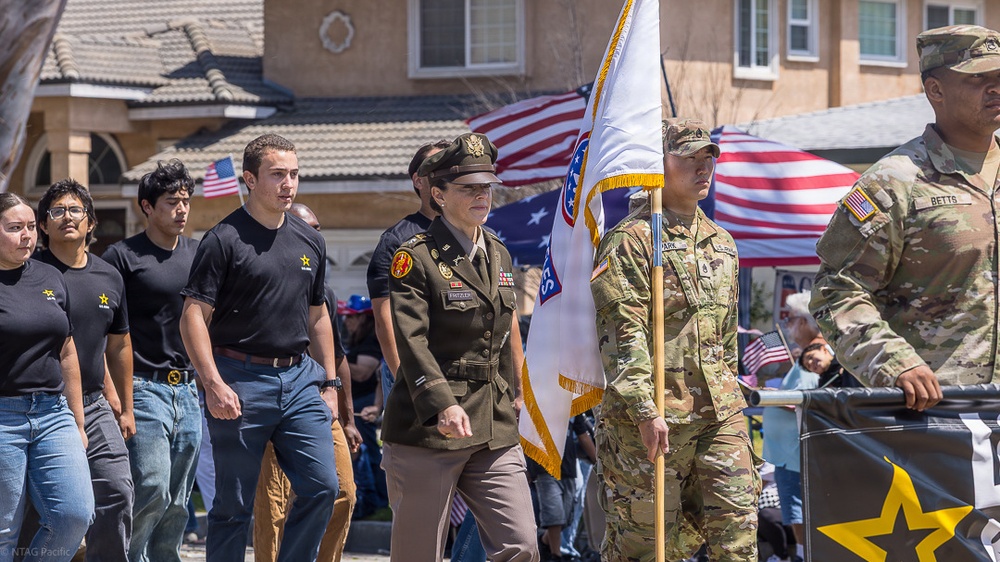 RECRUITERS ASSIGNED TO NAVY TALENT ACQUISITION GROUP PACIFIC PARTICIPATE IN THE ARMED FORCES DAY PARADE IN TORRANCE, CALIFORNIA.