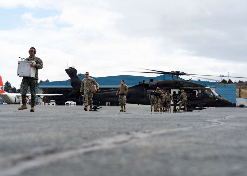 Joint-Service Members Unload Personnel and Supplies Following Village Outreach Missions During Kodiak Arctic Care 2026