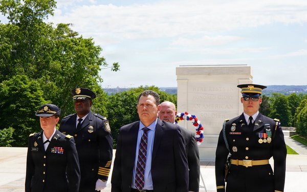 Members of law enforcement from Joint Base Myer-Henderson Hall lay wreath at Tomb of The Unknown Soldier