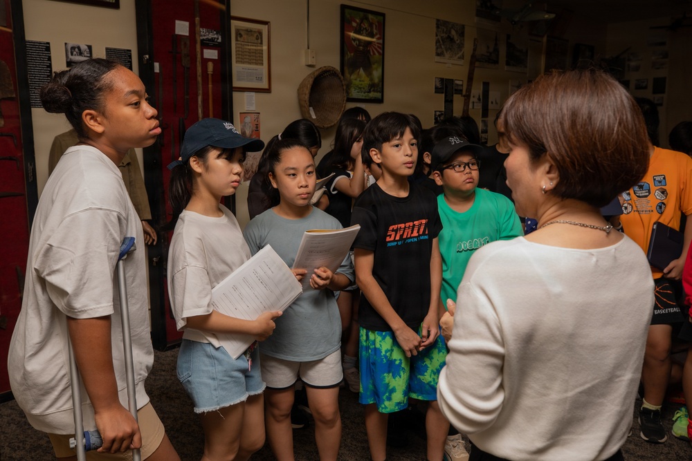 Local Okinawa Elementary students visit the Battle of Okinawa Museum aboard Camp Kinser