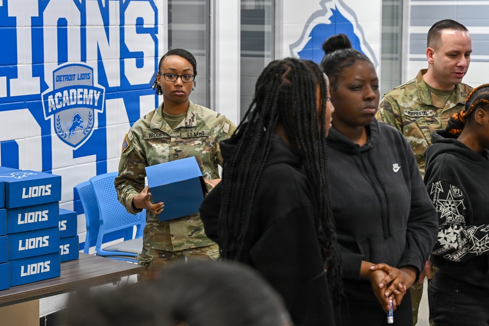 U.S. Army Tank-automotive and Armaments Command and Detroit Arsenal Soldiers join Detroit Lions Academy students to pack care kits for deployed Soldiers