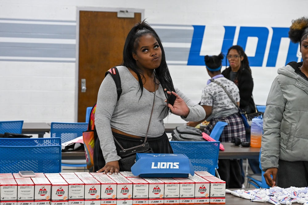 U.S. Army Tank-automotive and Armaments Command and Detroit Arsenal Soldiers join Detroit Lions Academy students to pack care kits for deployed Soldiers