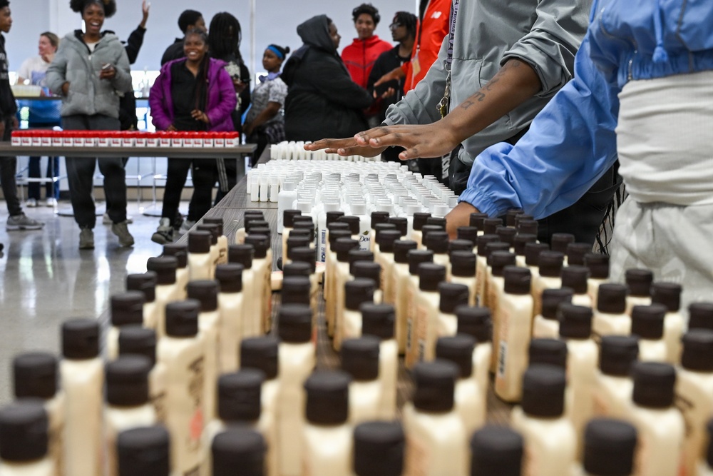 U.S. Army Tank-automotive and Armaments Command and Detroit Arsenal Soldiers join Detroit Lions Academy students to pack care kits for deployed Soldiers