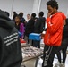 U.S. Army Tank-automotive and Armaments Command and Detroit Arsenal Soldiers join Detroit Lions Academy students to pack care kits for deployed Soldiers