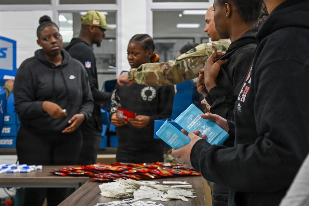 U.S. Army Tank-automotive and Armaments Command and Detroit Arsenal Soldiers join Detroit Lions Academy students to pack care kits for deployed Soldiers