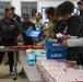 U.S. Army Tank-automotive and Armaments Command and Detroit Arsenal Soldiers join Detroit Lions Academy students to pack care kits for deployed Soldiers