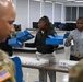U.S. Army Tank-automotive and Armaments Command and Detroit Arsenal Soldiers join Detroit Lions Academy students to pack care kits for deployed Soldiers