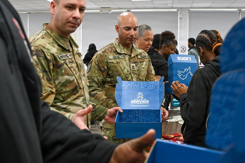 U.S. Army Tank-automotive and Armaments Command and Detroit Arsenal Soldiers join Detroit Lions Academy students to pack care kits for deployed Soldiers