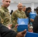 U.S. Army Tank-automotive and Armaments Command and Detroit Arsenal Soldiers join Detroit Lions Academy students to pack care kits for deployed Soldiers