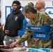 U.S. Army Tank-automotive and Armaments Command and Detroit Arsenal Soldiers join Detroit Lions Academy students to pack care kits for deployed Soldiers