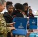 U.S. Army Tank-automotive and Armaments Command and Detroit Arsenal Soldiers join Detroit Lions Academy students to pack care kits for deployed Soldiers