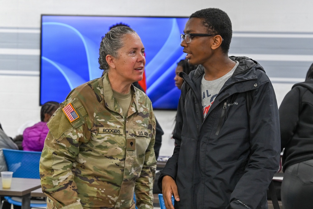 U.S. Army Tank-automotive and Armaments Command and Detroit Arsenal Soldiers join Detroit Lions Academy students to pack care kits for deployed Soldiers