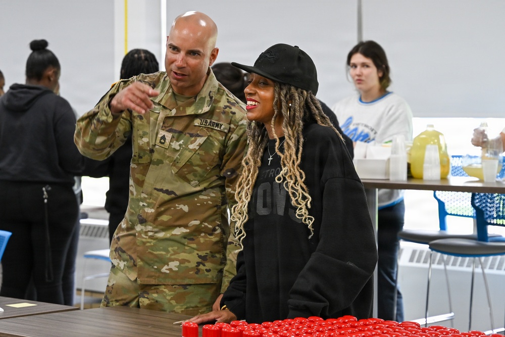 U.S. Army Tank-automotive and Armaments Command and Detroit Arsenal Soldiers join Detroit Lions Academy students to pack care kits for deployed Soldiers