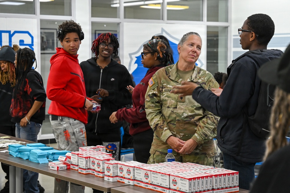 U.S. Army Tank-automotive and Armaments Command and Detroit Arsenal Soldiers join Detroit Lions Academy students to pack care kits for deployed Soldiers
