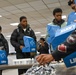U.S. Army Tank-automotive and Armaments Command and Detroit Arsenal Soldiers join Detroit Lions Academy students to pack care kits for deployed Soldiers