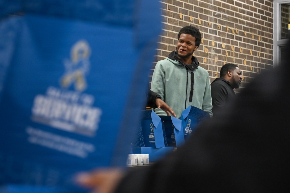 U.S. Army Tank-automotive and Armaments Command and Detroit Arsenal Soldiers join Detroit Lions Academy students to pack care kits for deployed Soldiers