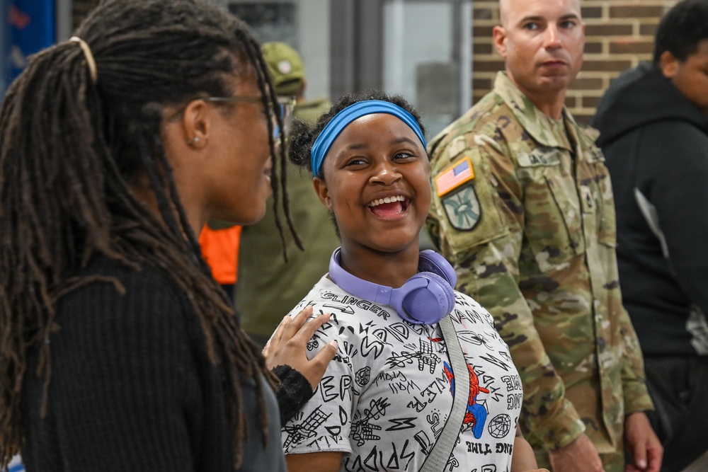 U.S. Army Tank-automotive and Armaments Command and Detroit Arsenal Soldiers join Detroit Lions Academy students to pack care kits for deployed Soldiers